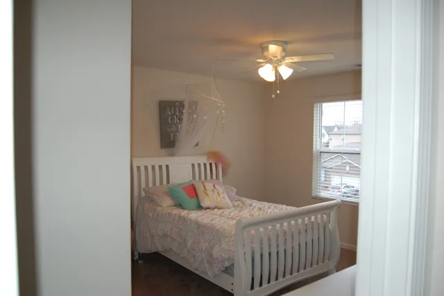 a bathroom with a granite countertop sink toilet and a mirror