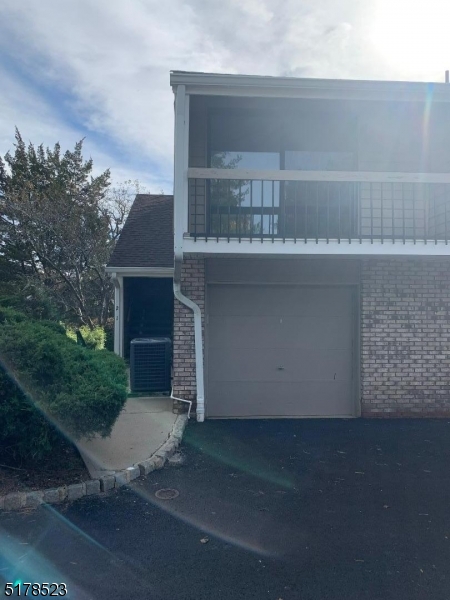2 Evergreen Drive Clinton, NJ 08809 - Photo 18 of 18 a backyard of a house with large trees and plants