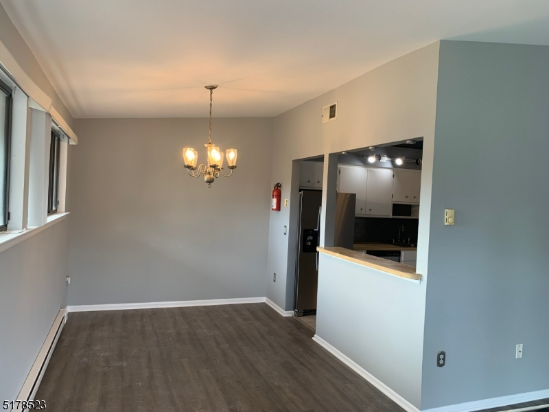 2 Evergreen Drive Clinton, NJ 08809 - Photo 6 of 18 a view of a kitchen with wooden floor and electronic appliances