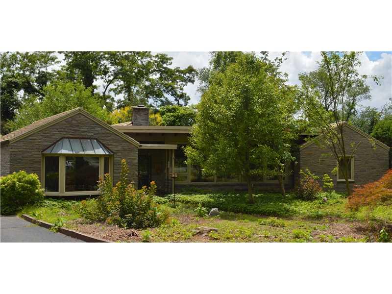 Exterior Front. Custom built mid century stone ranch with large yard and 2 car garage, pella windows, tile roof