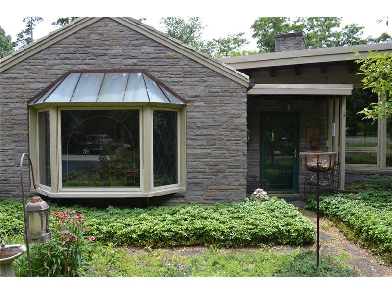 832 Ridgeview Drive Mt. Lebanon, PA 15228 - Photo 22 of 23 Exterior Front. A closer view of the front entry door and the large bay window in the dining room. Tile roof, and stone construction help to make this custom built 1950 s ranch a unique opportunity
