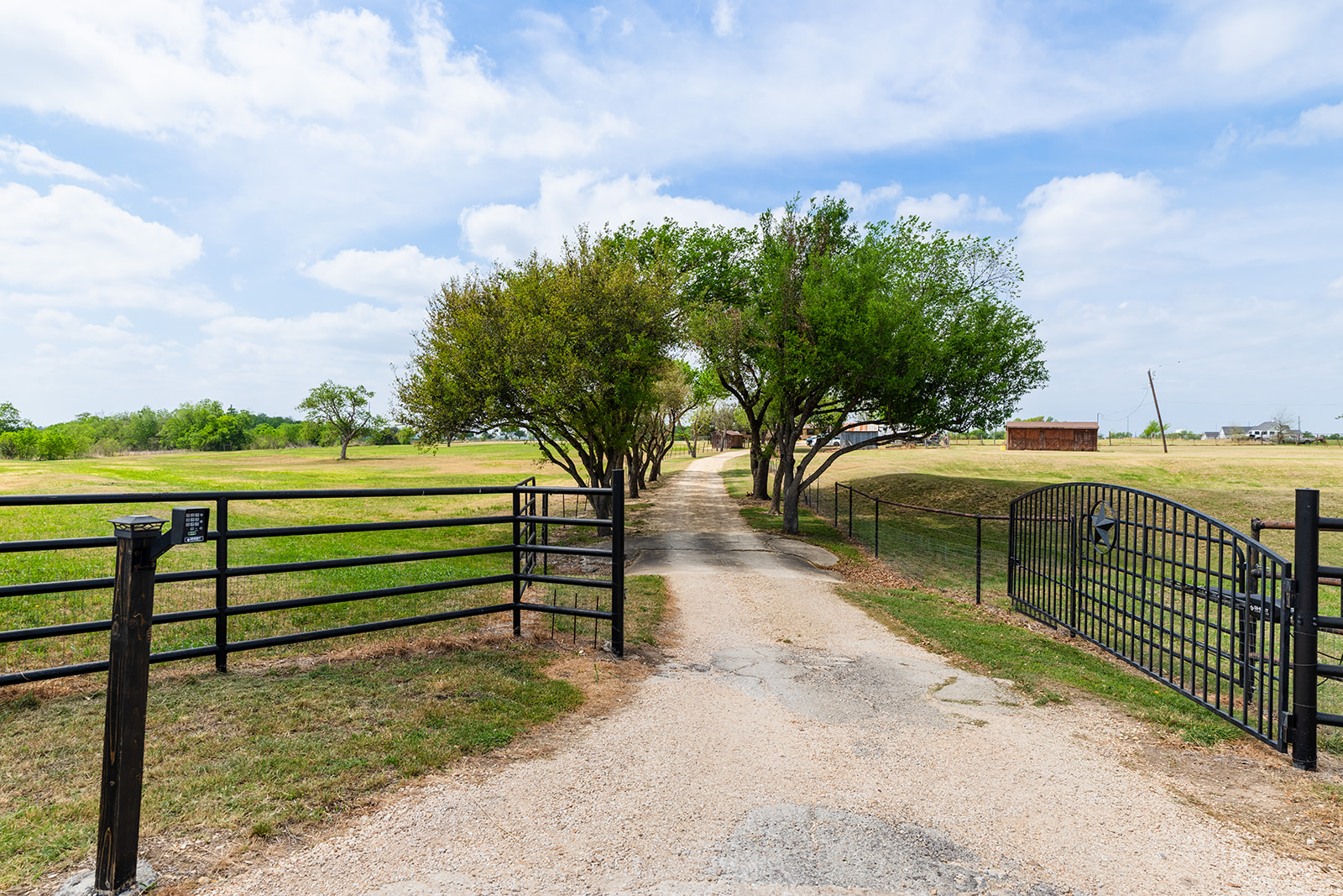 1001 Gravel Pit Road Taylor, TX 76574 - Photo 1 of 38 View of street featuring a gate and a view of countryside