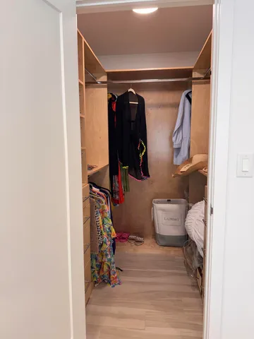 a bathroom with a shower sink vanity mirror and toilet