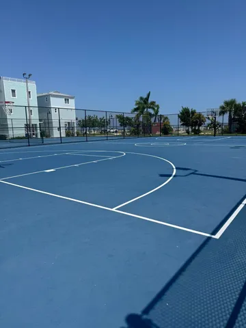a view of an apartment with a swimming pool