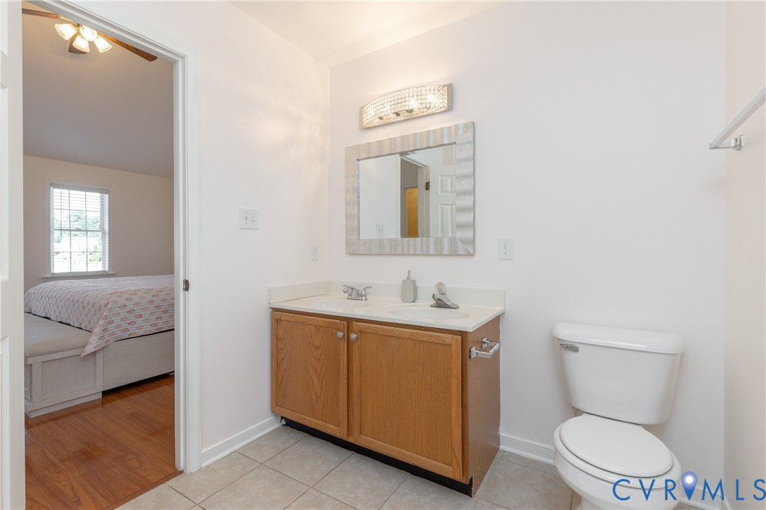 5101 Spring Bluff Road Midlothian, VA 23112 - Photo 32 of 47 Full bathroom featuring a wood-finish vanity with