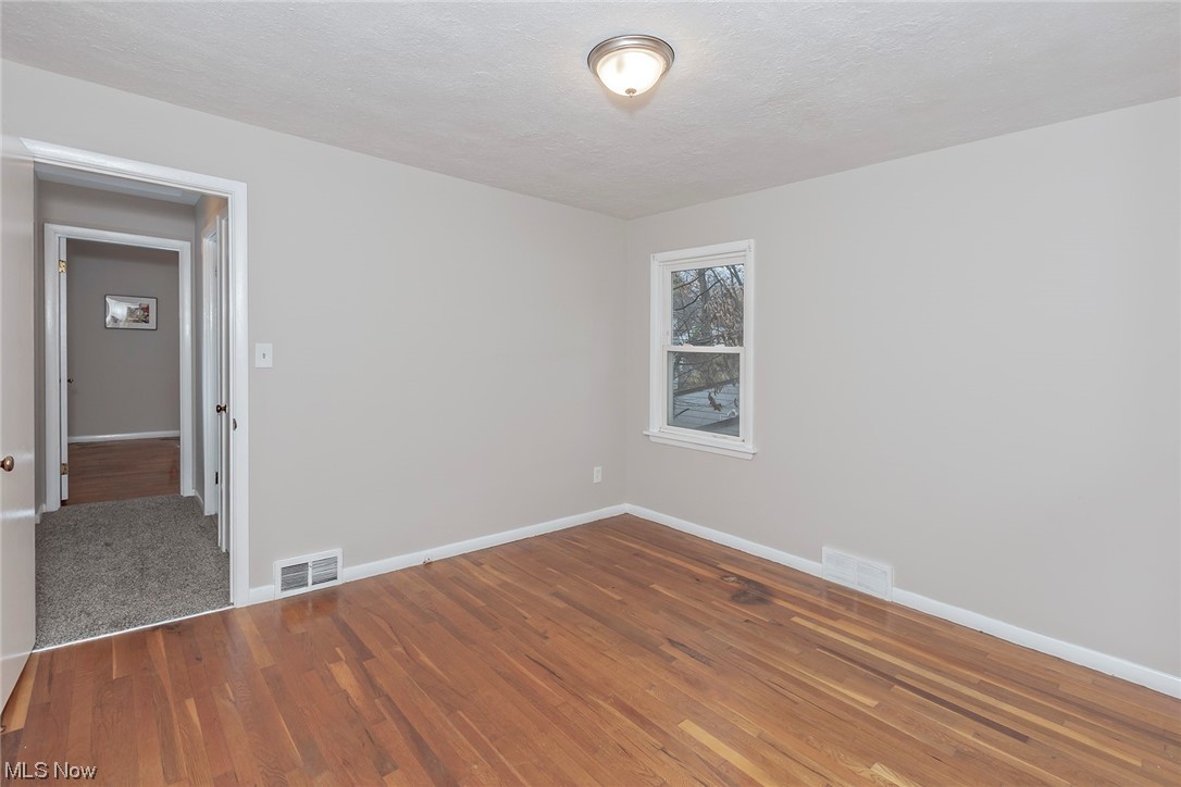 4402 Bayard Road South Euclid, OH 44121 - Photo 15 of 27 1st floor Owners bedroom with hardwood floors