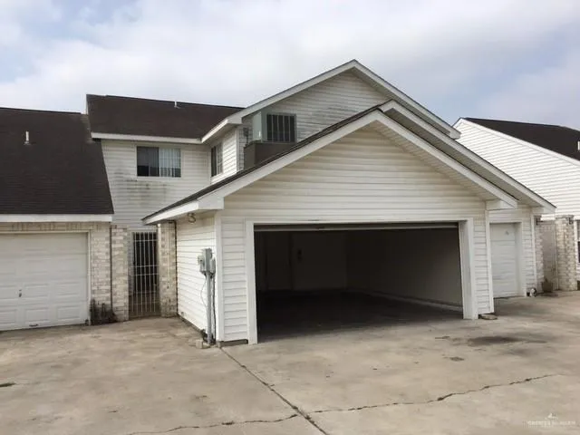 a view of house with garage