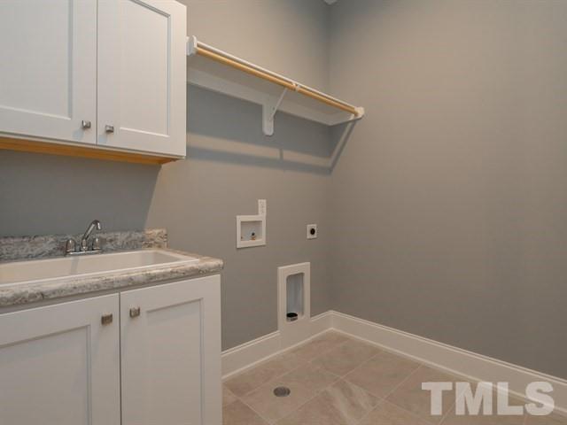 1425 Starry Night Court Raleigh, NC 27613 - Photo 20 of 33 a bathroom with a sink and cabinets