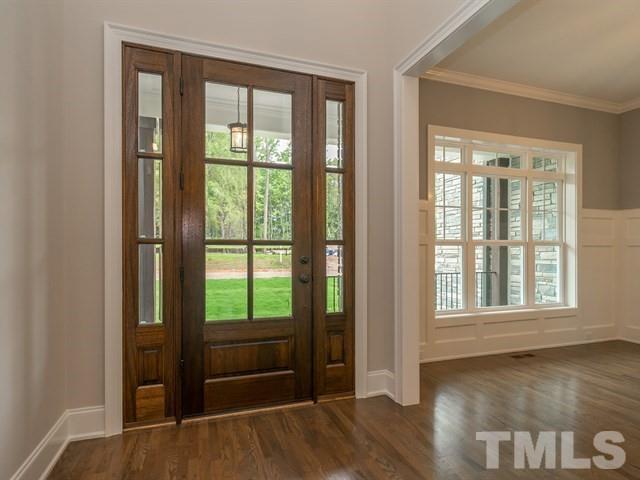 1425 Starry Night Court Raleigh, NC 27613 - Photo 2 of 33 an empty room with wooden floor and windows