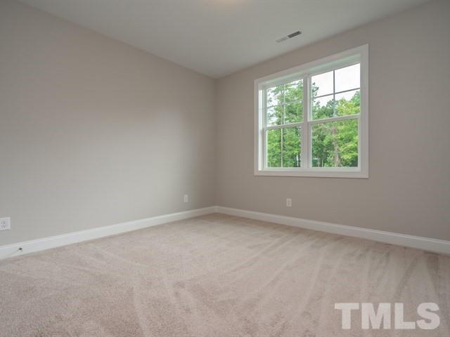 1425 Starry Night Court Raleigh, NC 27613 - Photo 23 of 33 an empty room with a window