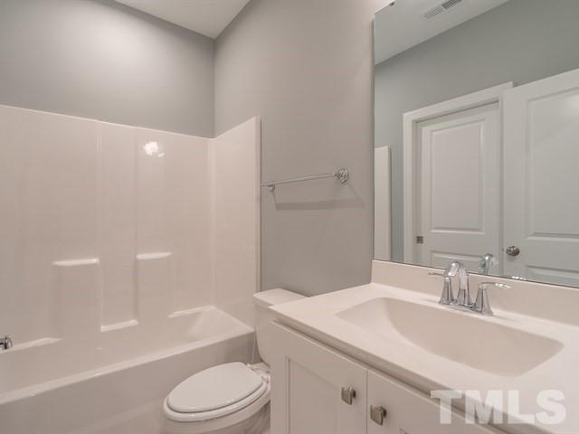1425 Starry Night Court Raleigh, NC 27613 - Photo 24 of 33 a bathroom with a sink toilet and a bathtub