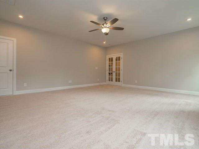 1425 Starry Night Court Raleigh, NC 27613 - Photo 29 of 33 a view of an empty room with a ceiling fan