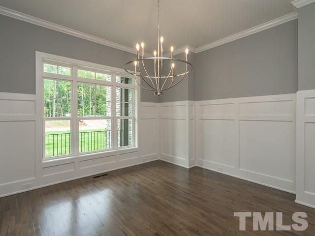 1425 Starry Night Court Raleigh, NC 27613 - Photo 6 of 33 an empty room with wooden floor and windows