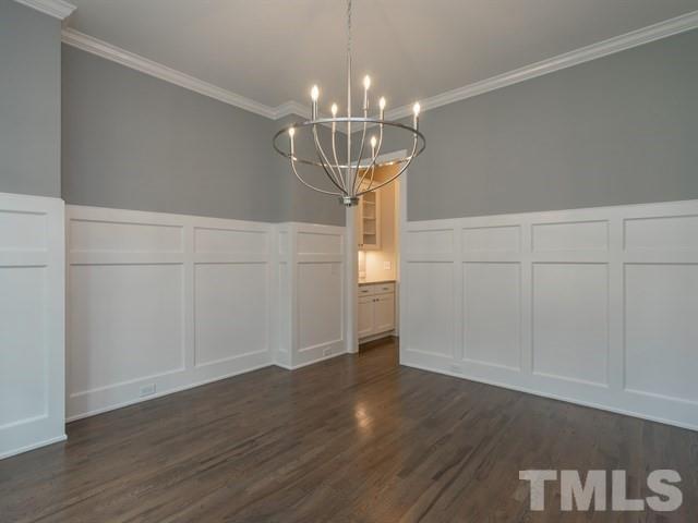 1425 Starry Night Court Raleigh, NC 27613 - Photo 7 of 33 a decorative lighting room with wooden floor