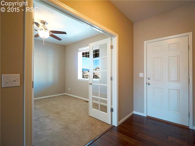 1474 Diamond Rim Drive Colorado Springs, CO 80921 - Photo 3 of 17 Beautiful hand scraped wood floors greet you at the front door.