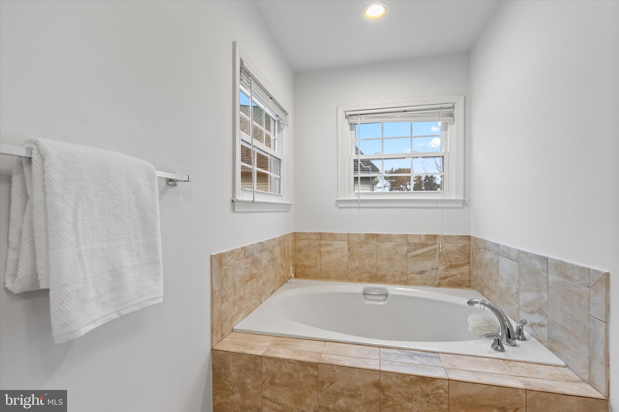14810 Cherry Leaf Terrace Silver Spring, MD 20906 - Photo 17 of 35 a bathroom with bathtub and window