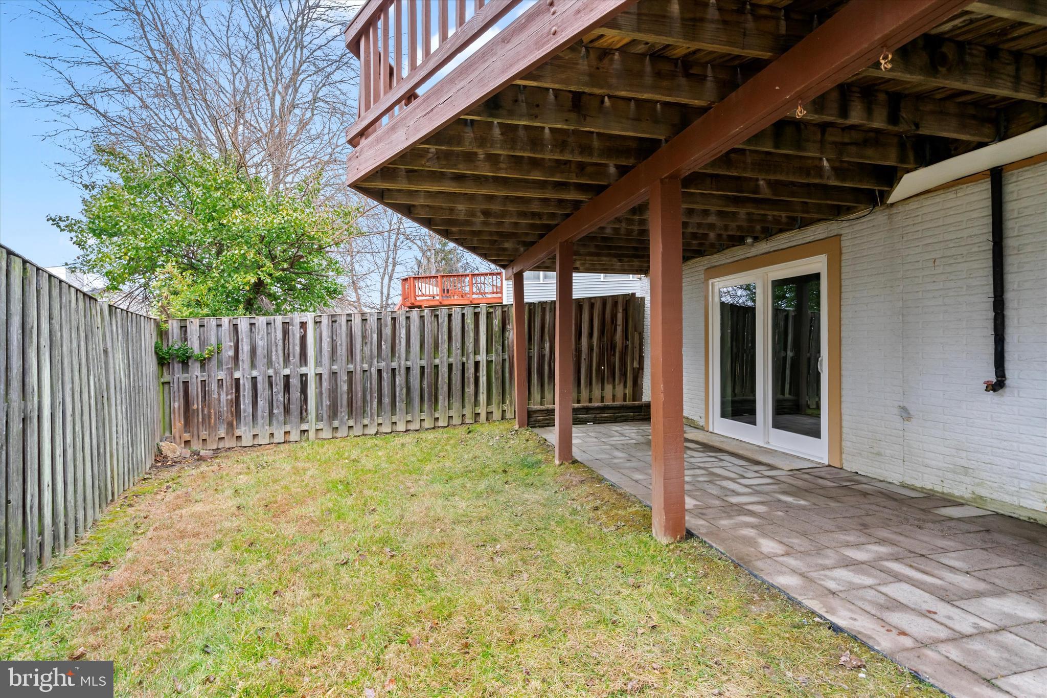 14810 Cherry Leaf Terrace Silver Spring, MD 20906 - Photo 30 of 35 a view of a backyard with wooden fence and trees