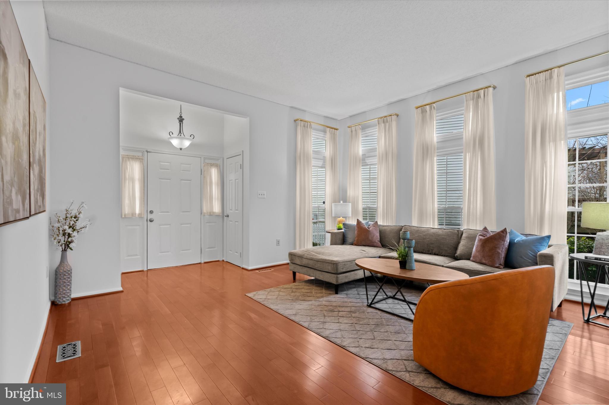 14810 Cherry Leaf Terrace Silver Spring, MD 20906 - Photo 3 of 35 a living room with furniture and large windows