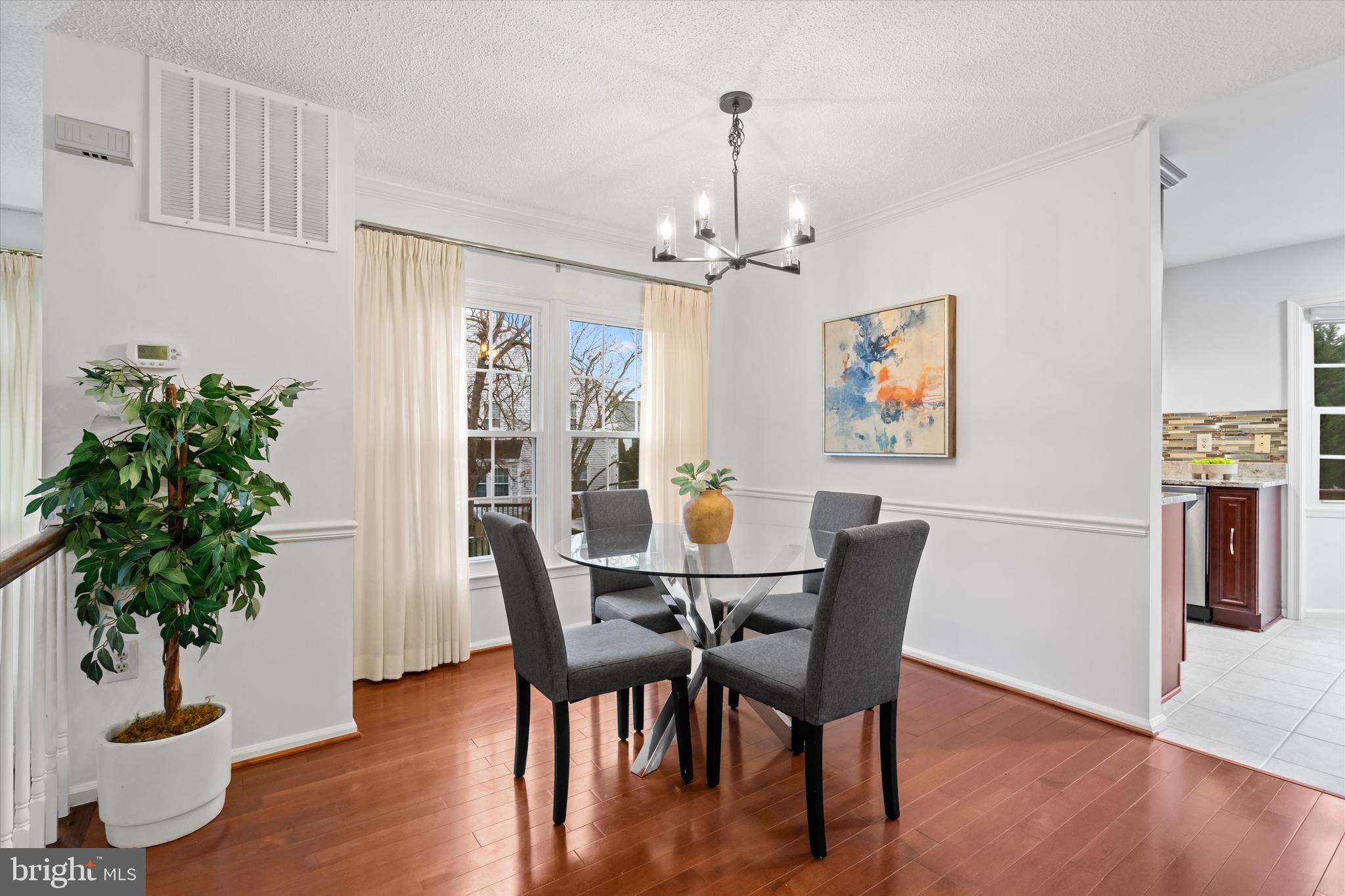 14810 Cherry Leaf Terrace Silver Spring, MD 20906 - Photo 5 of 35 a view of a dining room with furniture window and wooden floor