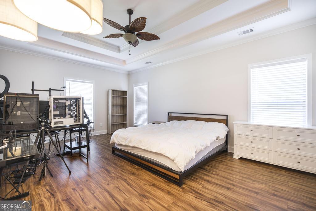 219 Rowland Circle Byron, GA 31008 - Photo 19 of 47 a bedroom with a bed and a table