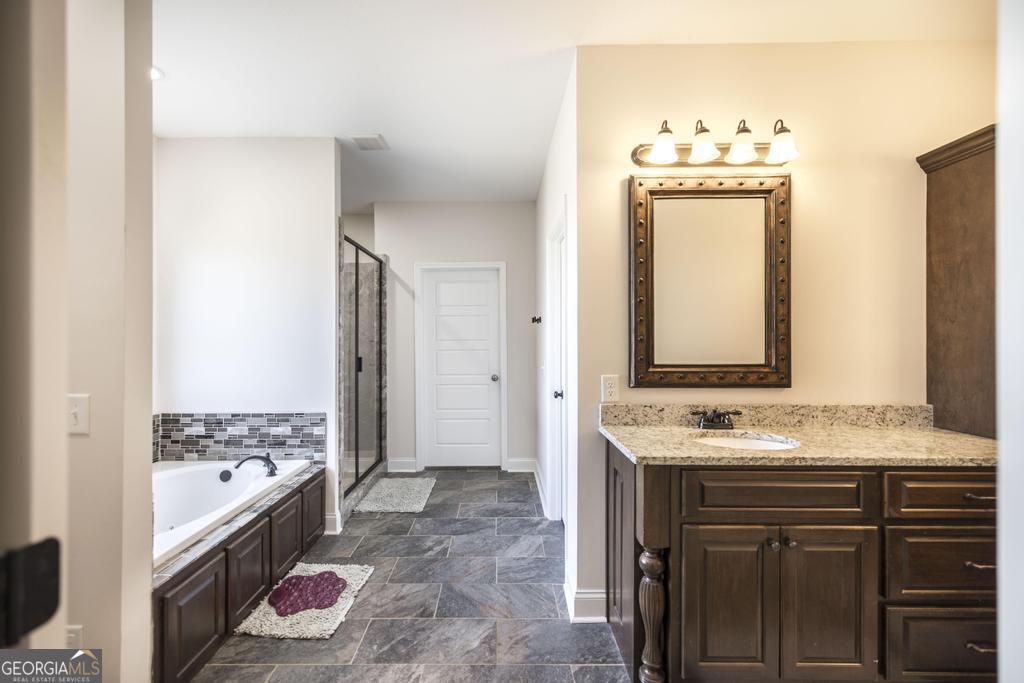 219 Rowland Circle Byron, GA 31008 - Photo 21 of 47 a bathroom with a sink and a mirror