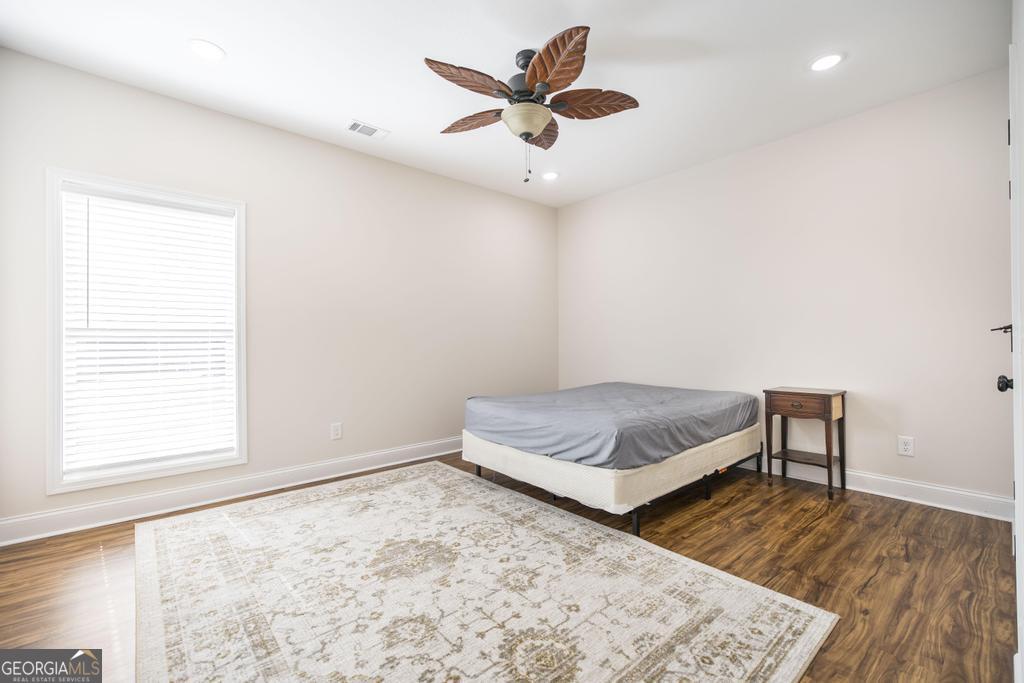 219 Rowland Circle Byron, GA 31008 - Photo 27 of 47 a bedroom with a bed and window