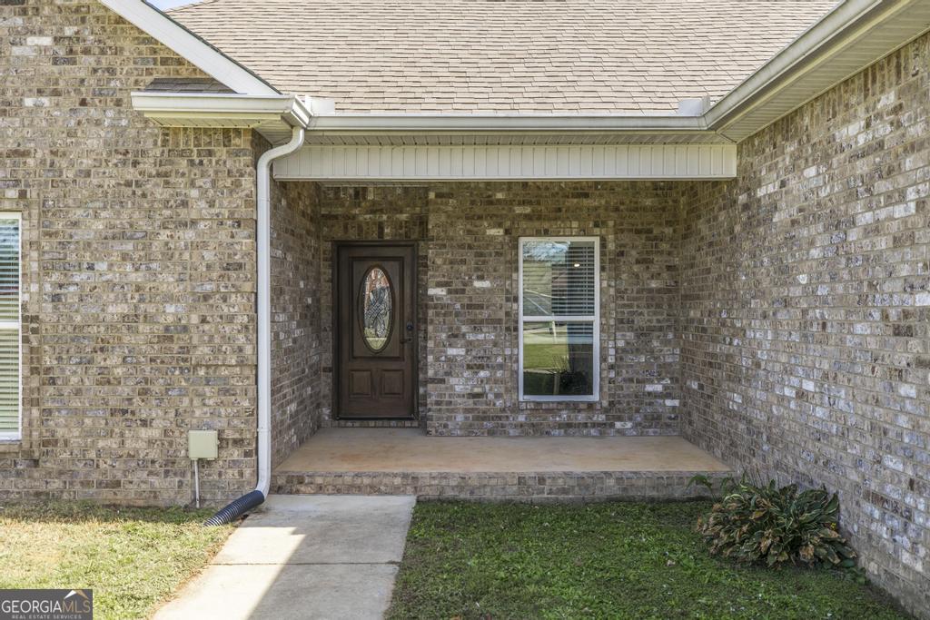 219 Rowland Circle Byron, GA 31008 - Photo 7 of 47 a front view of a house with garden