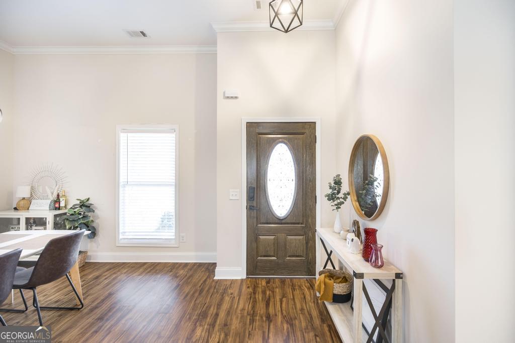 219 Rowland Circle Byron, GA 31008 - Photo 8 of 47 a view of a livingroom with furniture wooden floor mirror and window