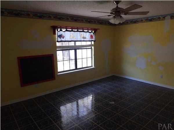 5538 Allie Rae Street Milton, FL 32570 - Photo 9 of 24 First bedroom just needs a little paint