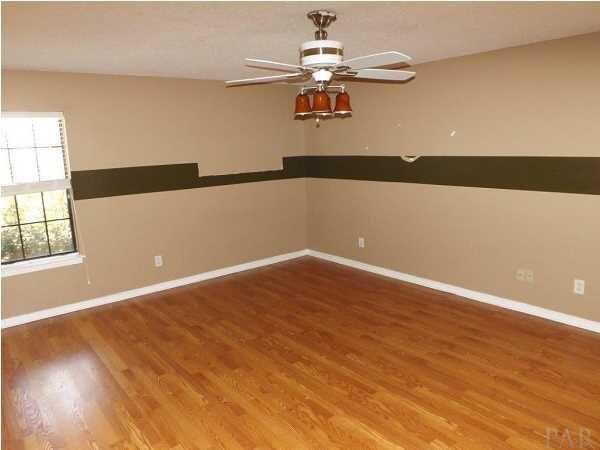 5538 Allie Rae Street Milton, FL 32570 - Photo 10 of 24 The second bedroom has nice flooring and is spacious