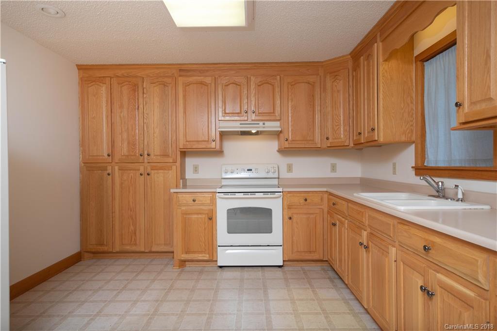 2746 Sawmill Road Hickory Grove, SC 29717 - Photo 13 of 27 a kitchen with stainless steel appliances granite countertop a stove a sink and a refrigerator