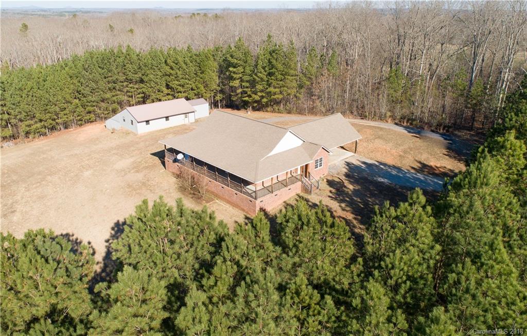 2746 Sawmill Road Hickory Grove, SC 29717 - Photo 26 of 27 an aerial view of a house with yard and trees in the background