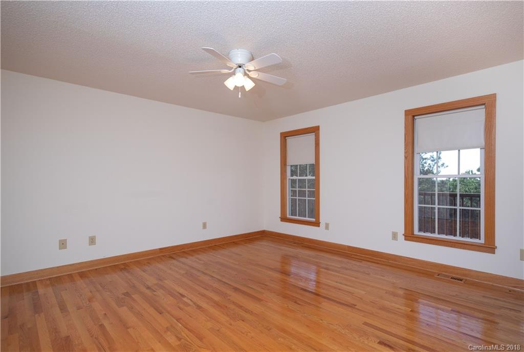 2746 Sawmill Road Hickory Grove, SC 29717 - Photo 4 of 27 a view of an empty room with wooden floor and a window