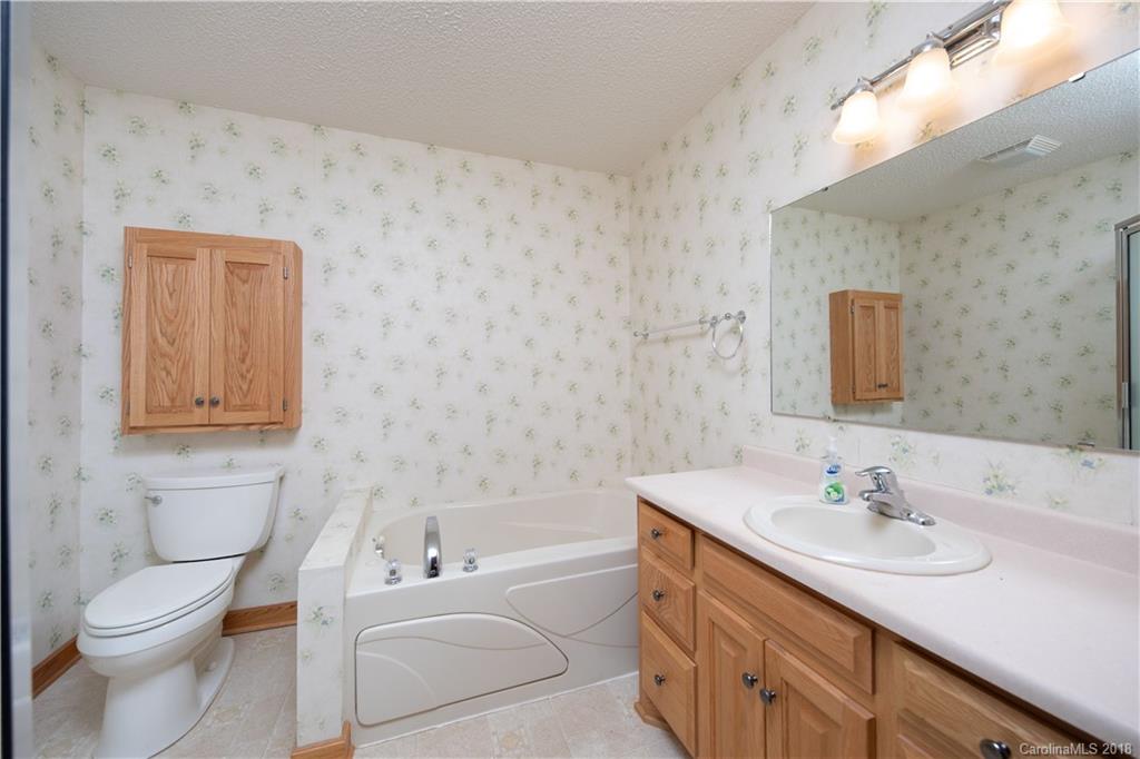 2746 Sawmill Road Hickory Grove, SC 29717 - Photo 6 of 27 a bathroom with a sink a toilet and vanity