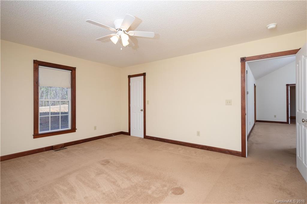 2746 Sawmill Road Hickory Grove, SC 29717 - Photo 9 of 27 an empty room with windows and fan