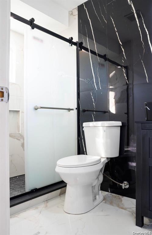 58 Hauppauge Road Hauppauge, NY 11788 - Photo 16 of 23 a bathroom with a toilet and a shower