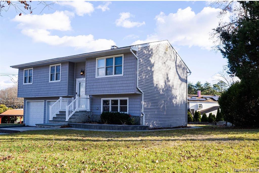 58 Hauppauge Road Hauppauge, NY 11788 - Photo 3 of 23 a view of a house with a swimming pool