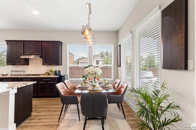 a view of a dining room with furniture window and outside view
