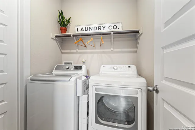 a utility room with dryer and washer