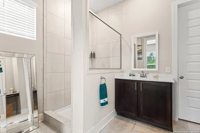 a bathroom with a bathtub and a sink
