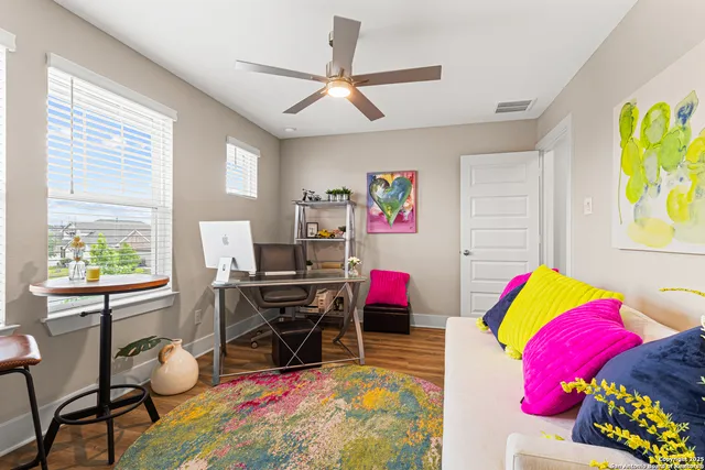 a bathroom with a granite countertop sink a toilet and a mirror
