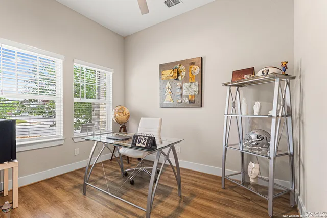 a work room with furniture and a window
