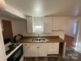 1141 6th Street Lancaster, SC 29720 - Photo 5 of 18 a kitchen with granite countertop a sink a stove and cabinets