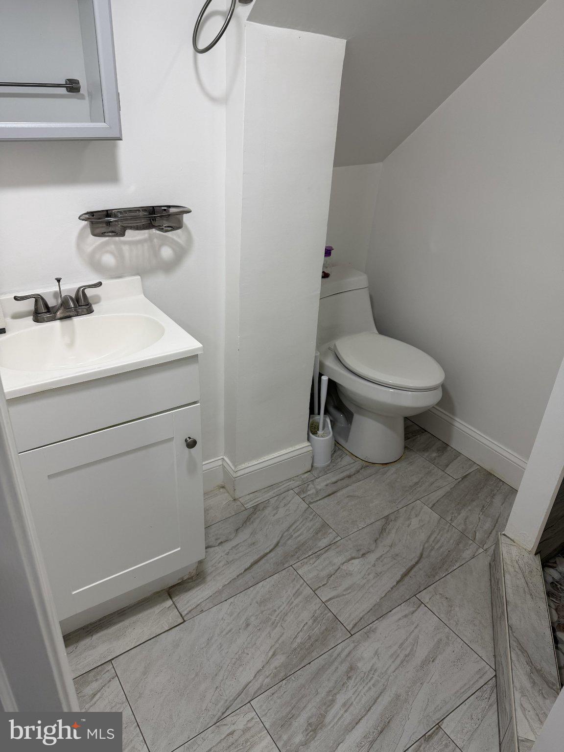 130 West Edgevale Road Baltimore, MD 21225 - Photo 12 of 37 a bathroom with a toilet and a sink