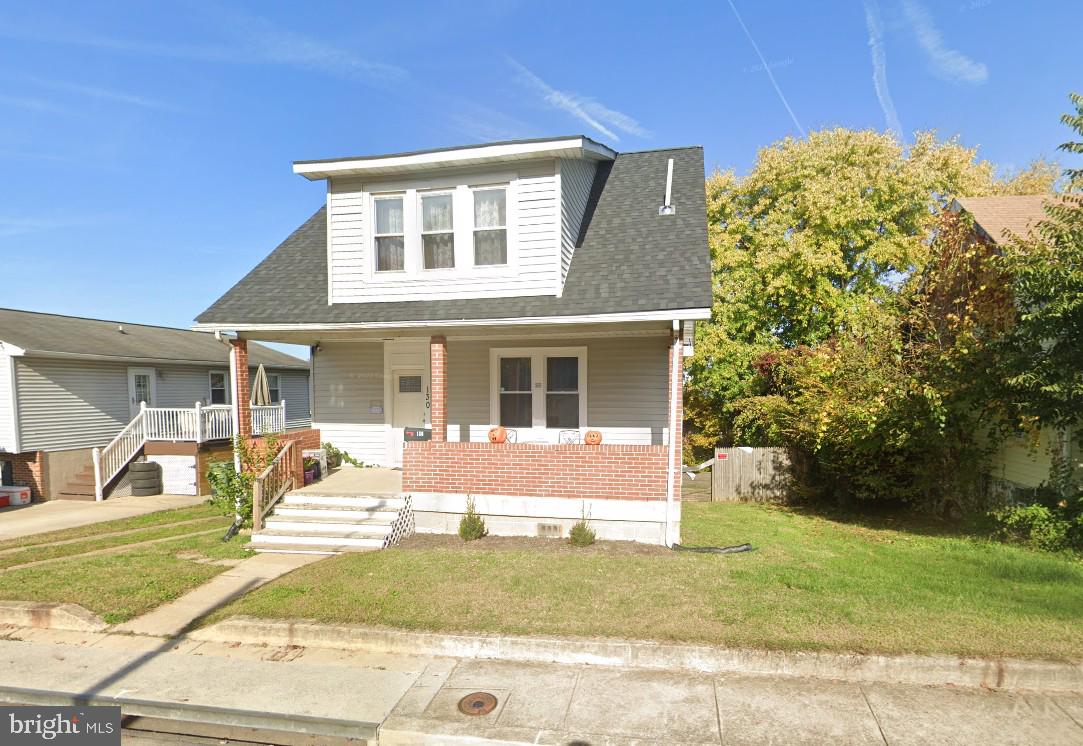 130 West Edgevale Road Baltimore, MD 21225 - Photo 2 of 37 a view of a house with a yard