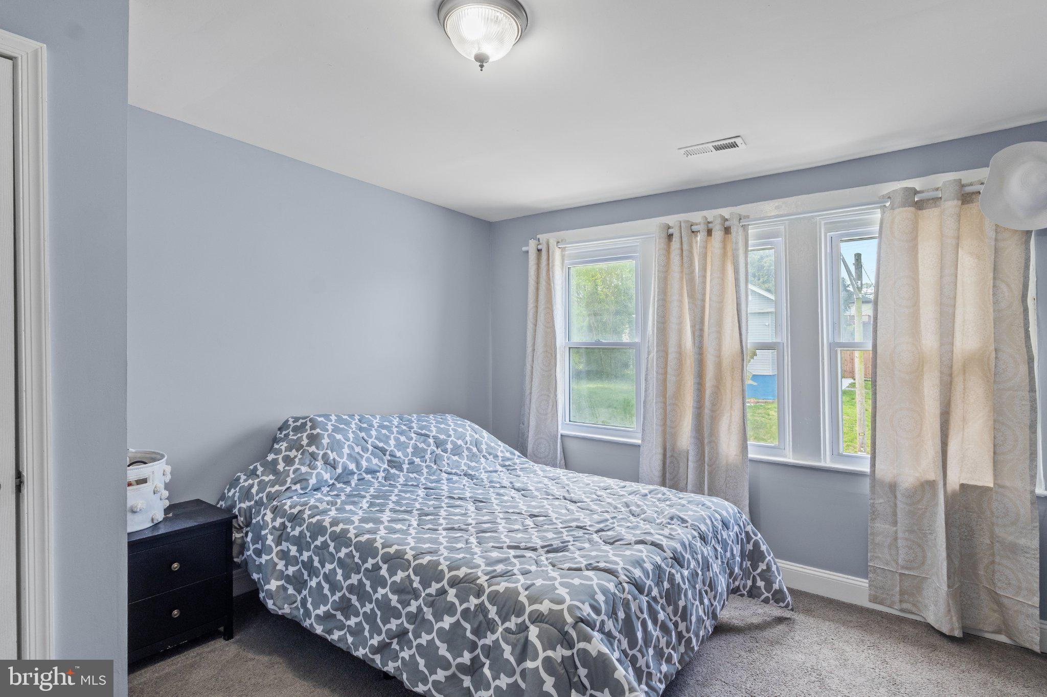 130 West Edgevale Road Baltimore, MD 21225 - Photo 22 of 37 a bedroom with a bed and a window
