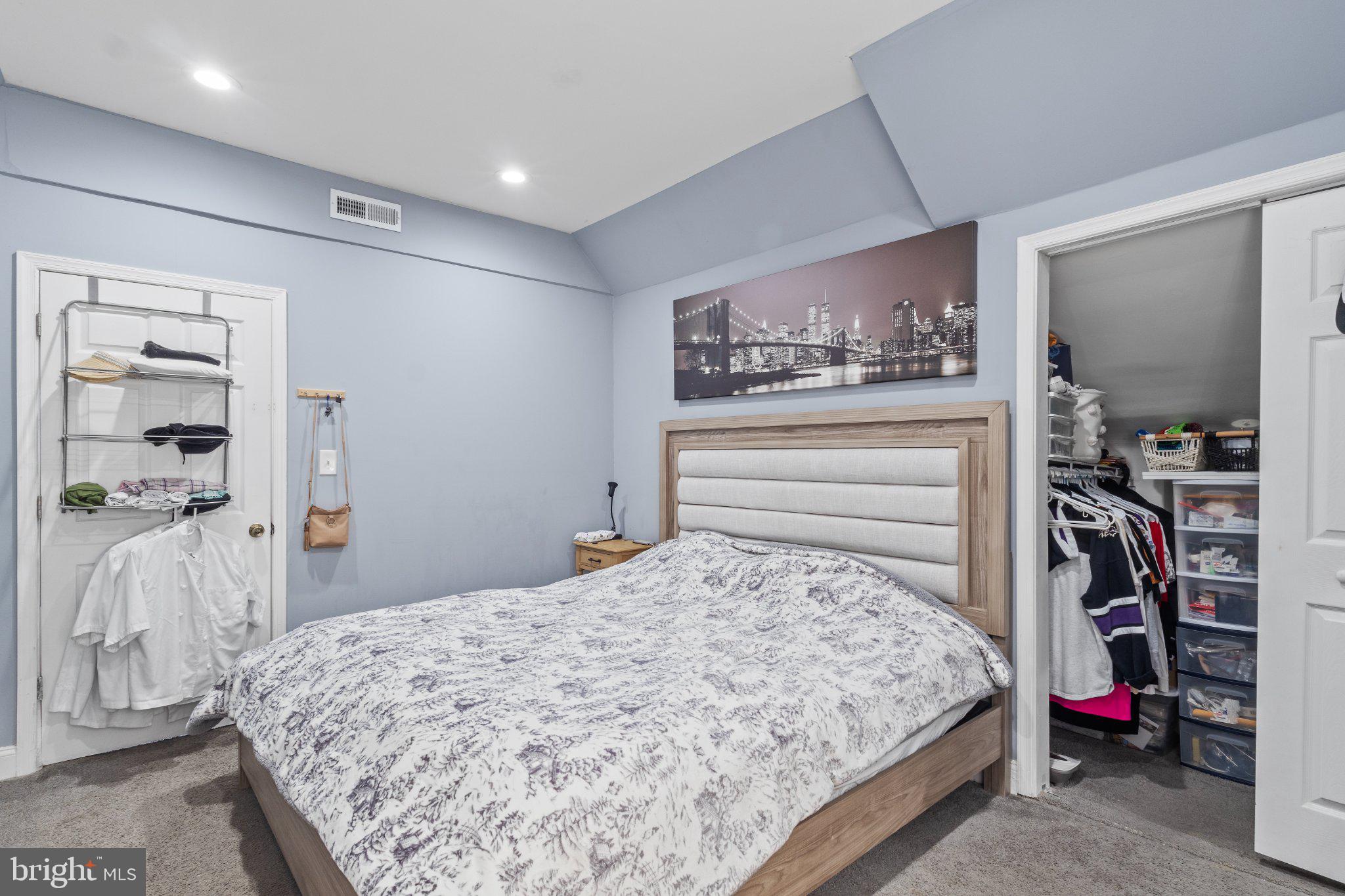 130 West Edgevale Road Baltimore, MD 21225 - Photo 24 of 37 a bedroom with a bed and a mirror