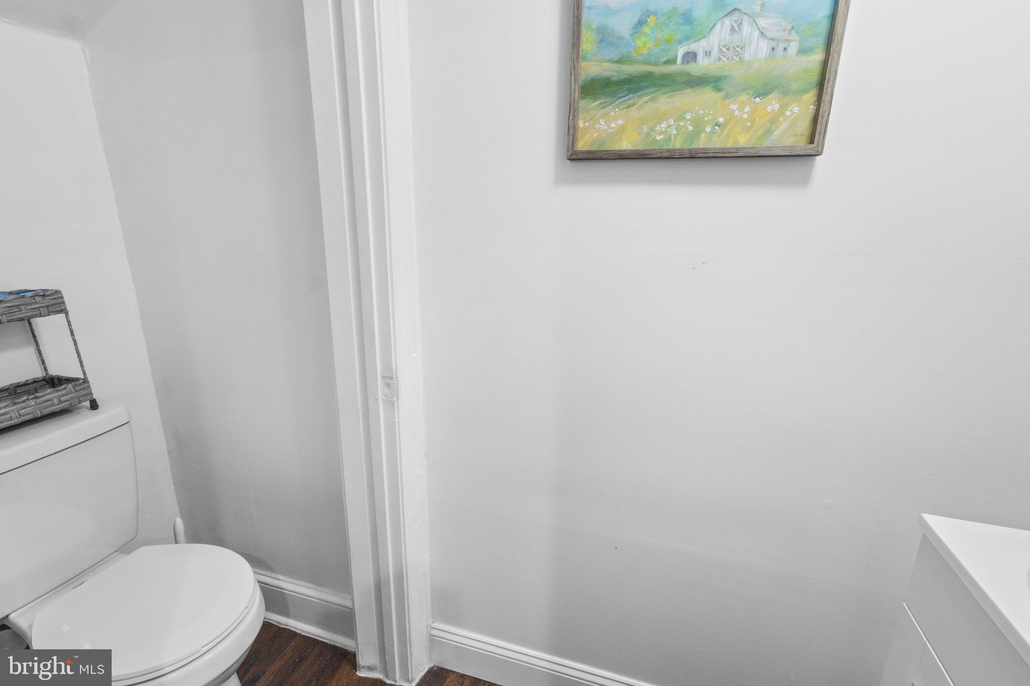 130 West Edgevale Road Baltimore, MD 21225 - Photo 32 of 37 a white toilet sitting next to a shower