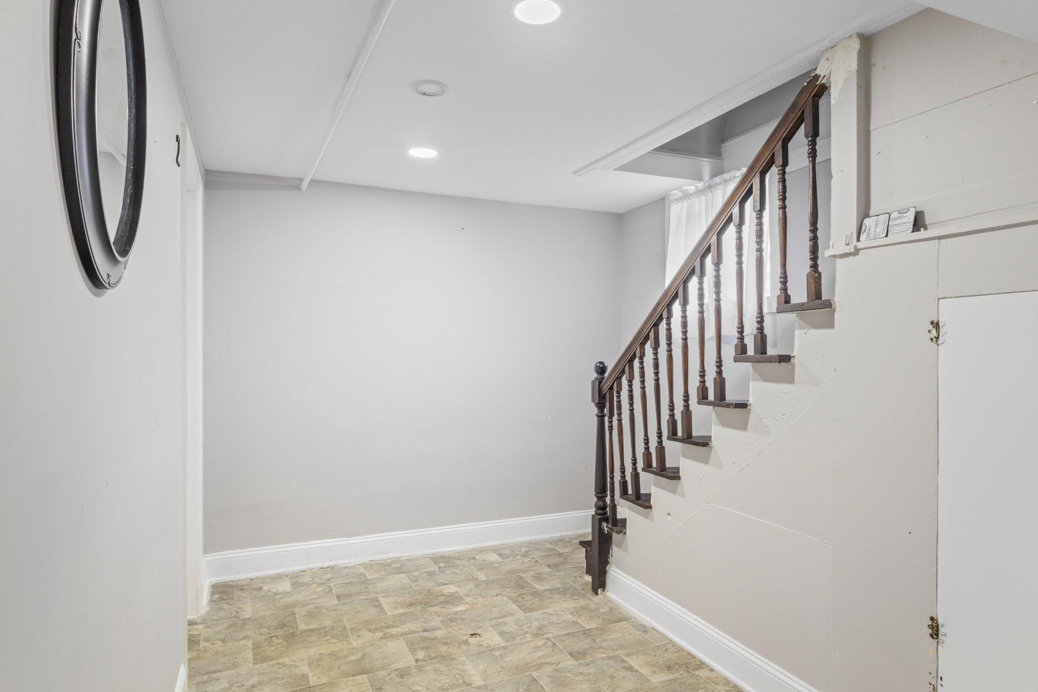 130 West Edgevale Road Baltimore, MD 21225 - Photo 33 of 37 a view of an entryway with stairs