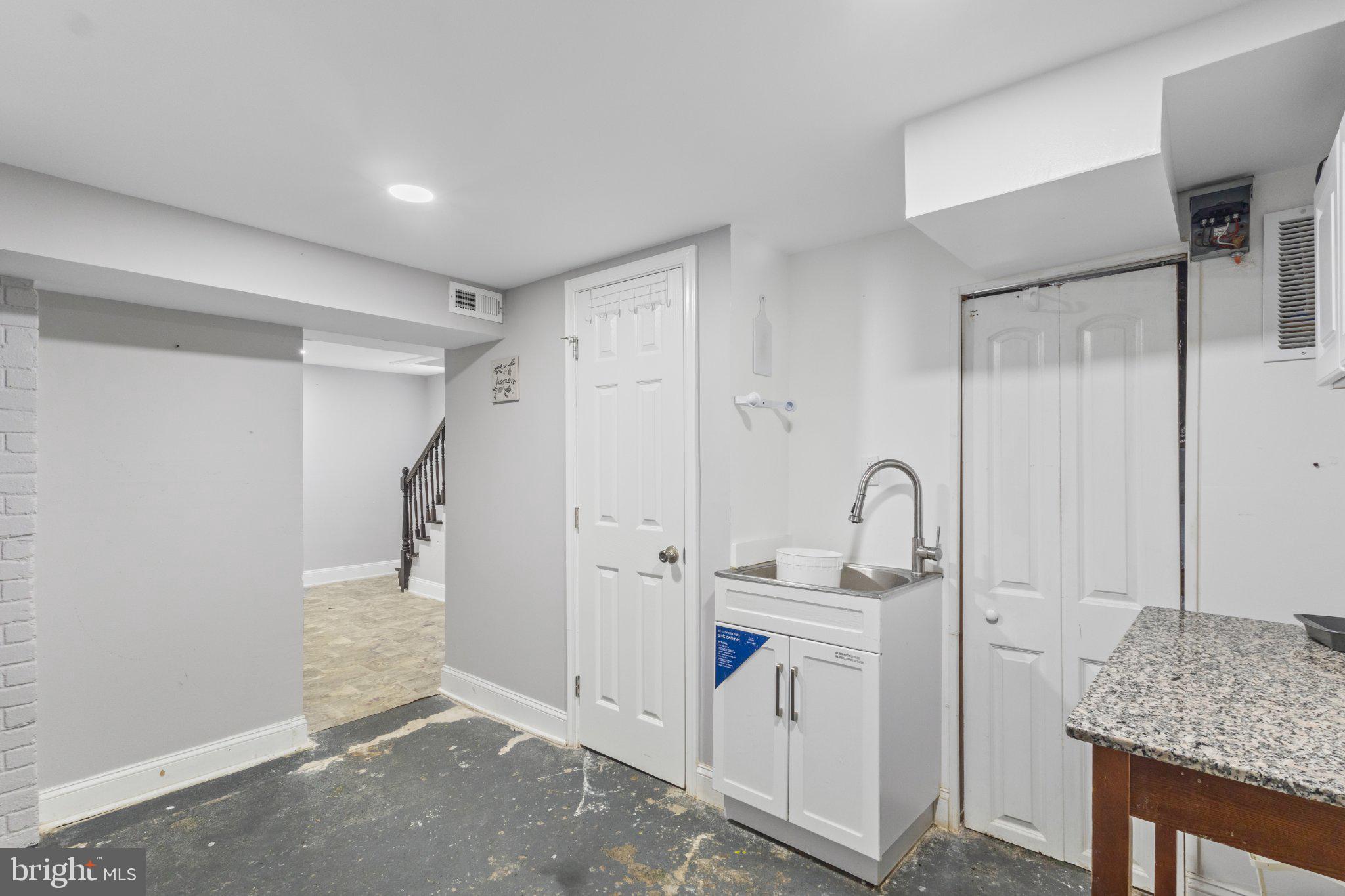 130 West Edgevale Road Baltimore, MD 21225 - Photo 34 of 37 a room with a sink and cabinets